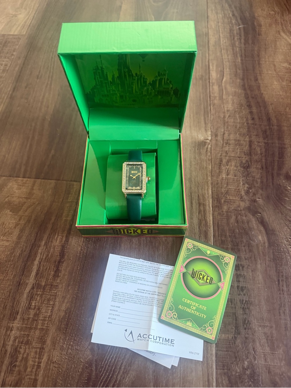 Universal Gold-Tone Rectangular Watch with Green Strap